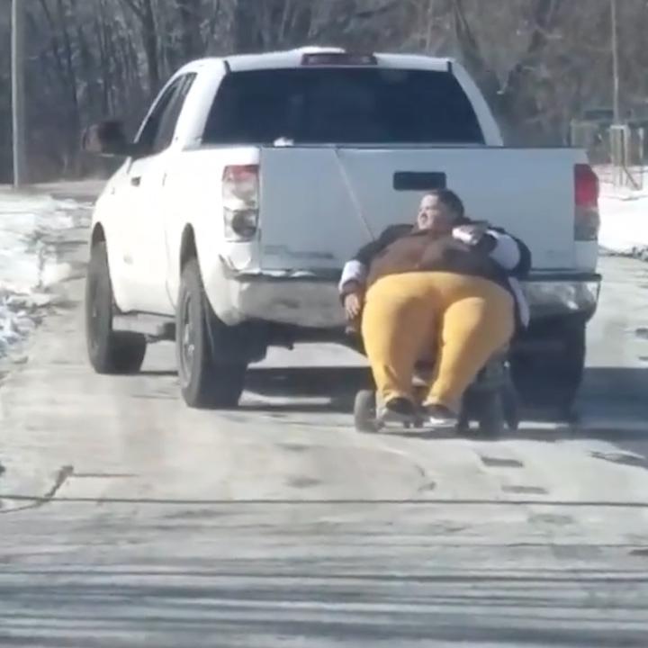 obese-woman-dragged-behind-truck-with-rope-because-shes-too-big-to-fit-inside-00_00_15_08-still009.jpg